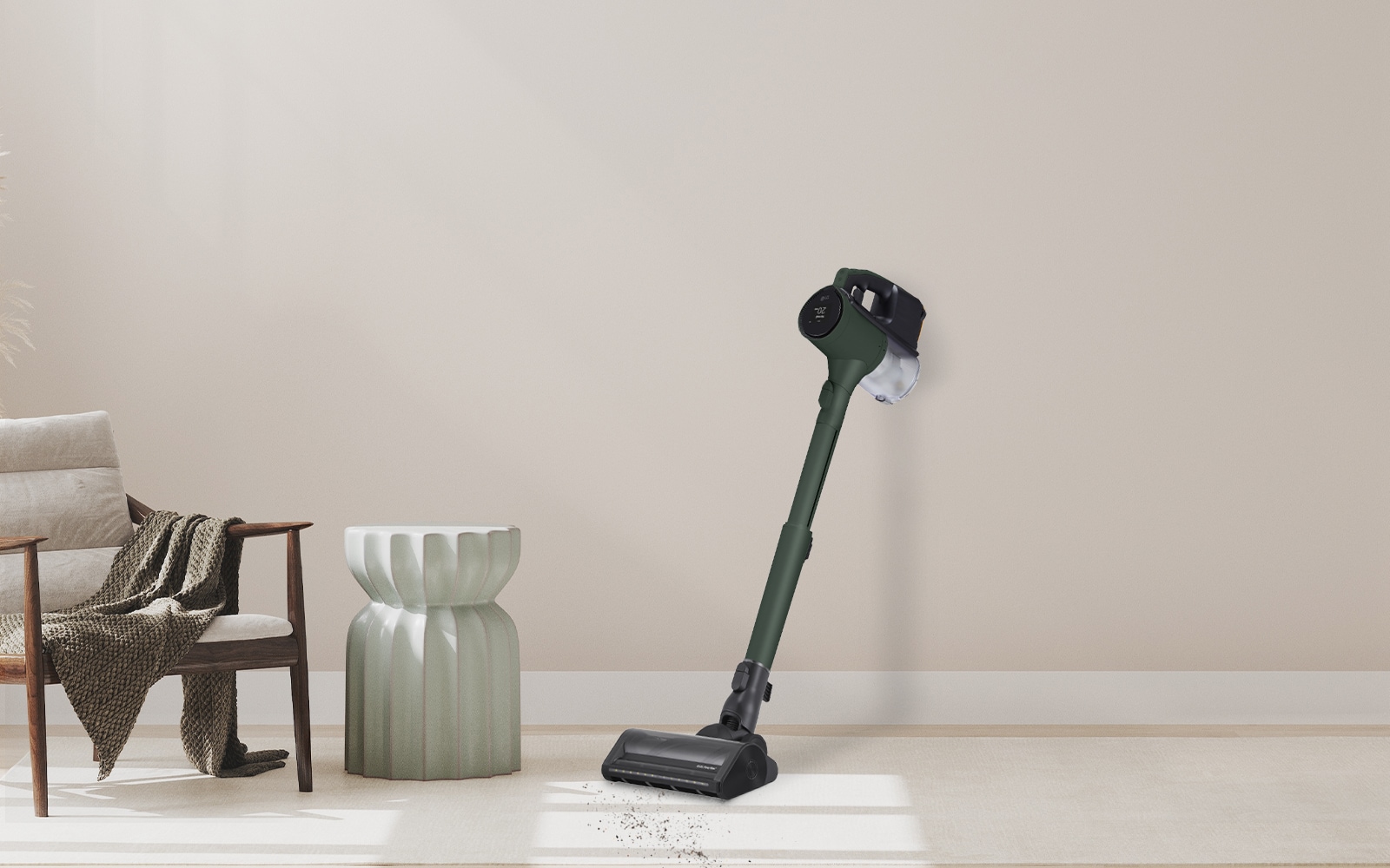 Stick vacuum leaning against the wall.